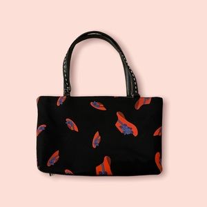 💿 Funky black shoulder purse with cute red hat design.